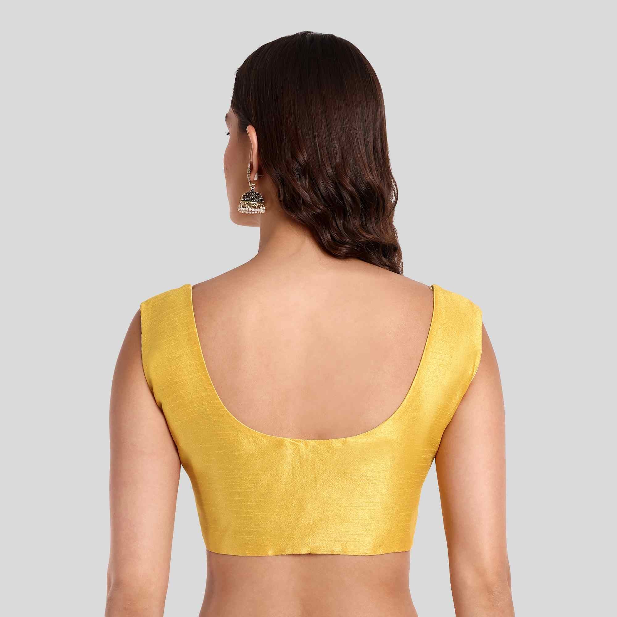 Yellow sleeveless blouse with normal low back neck