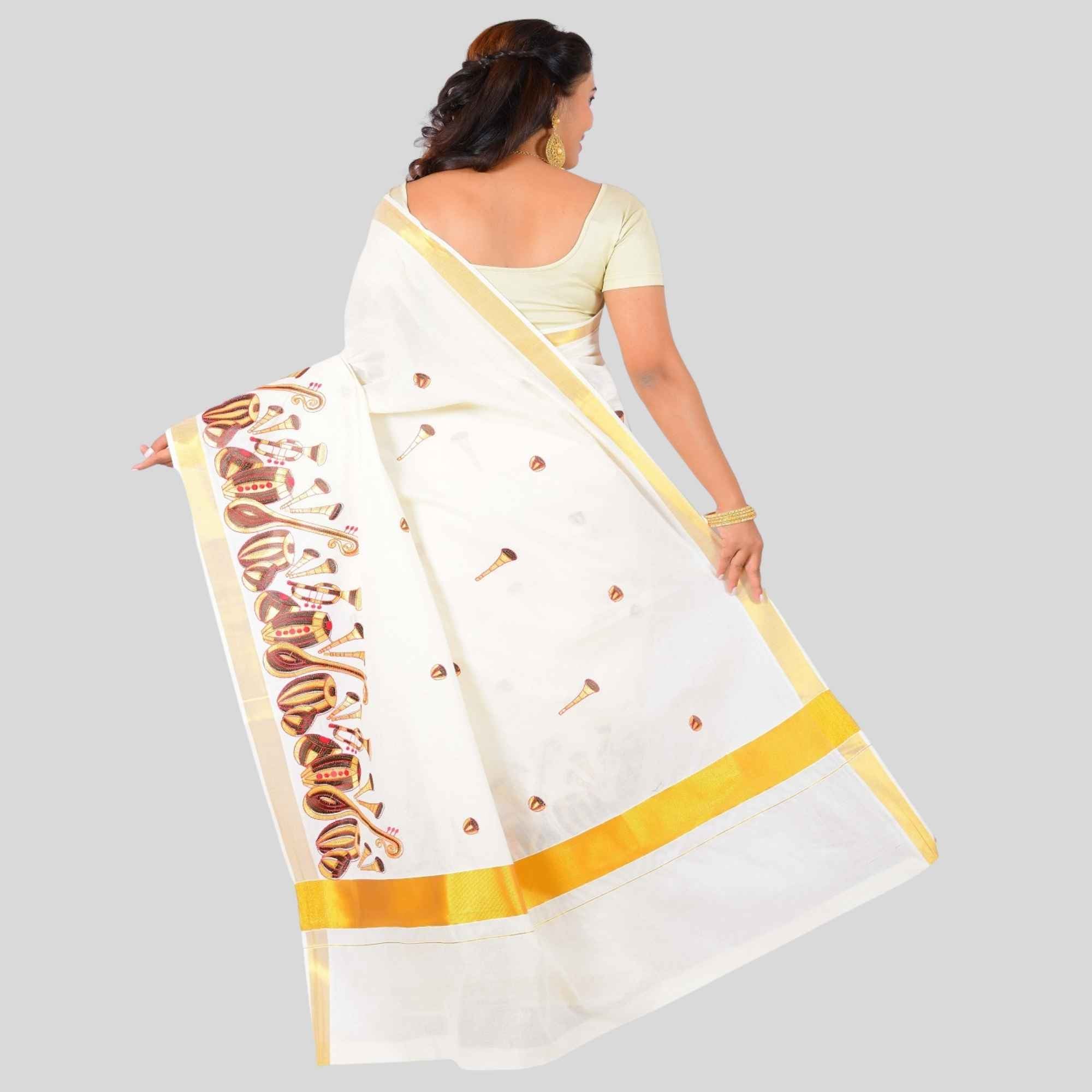 Kerala saree with veena and tabela design