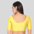 Silk readymade blouse in color yellow with neck piping