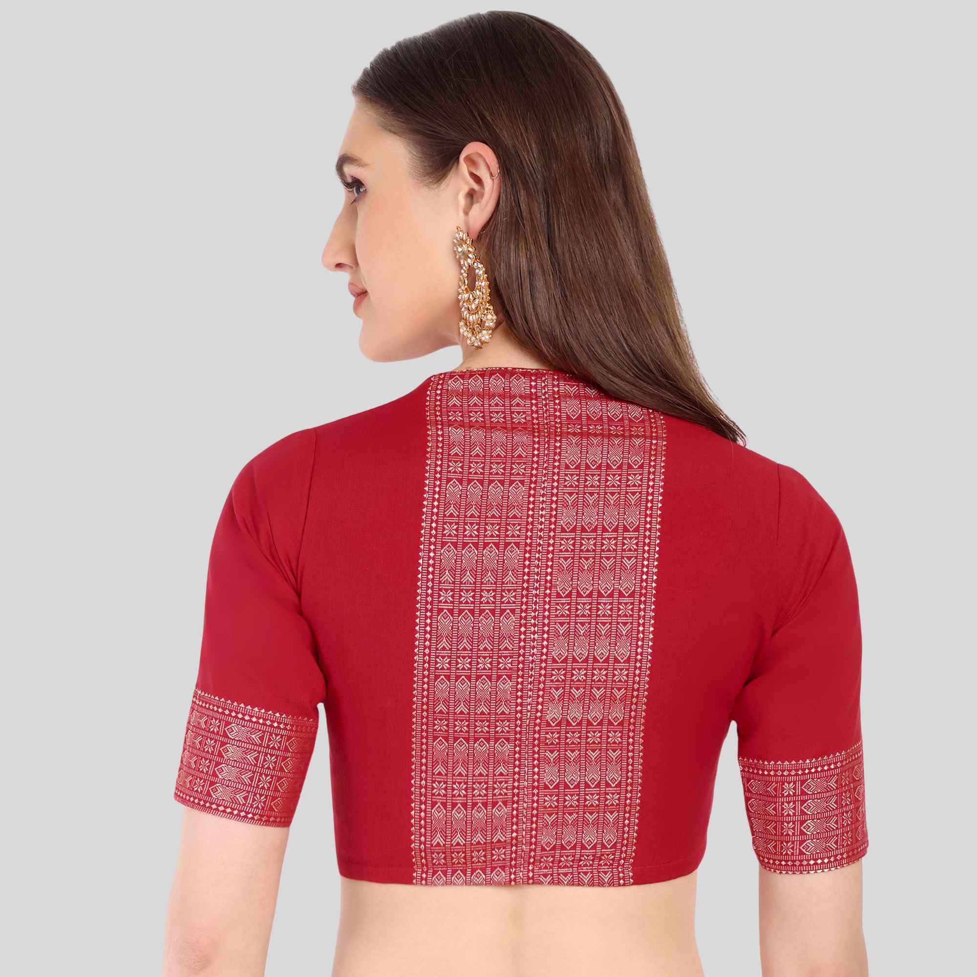 Red blouse with white patterns on a gray background